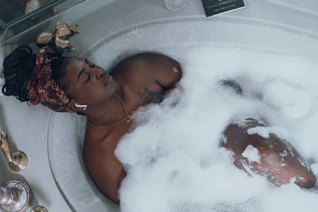 woman soaking in tub easy ways to practice self care soul bitch