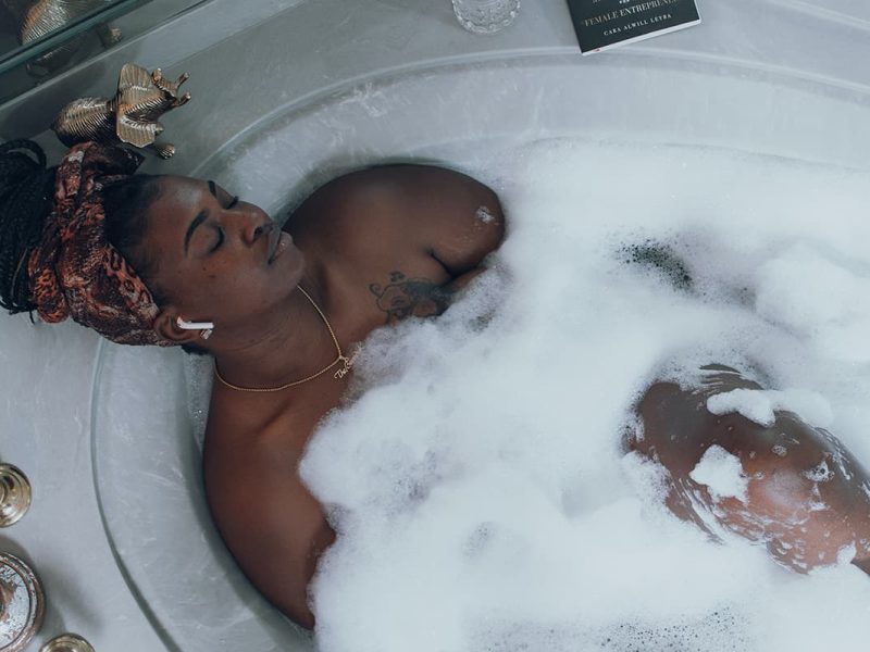 woman soaking in tub easy ways to practice self care soul bitch